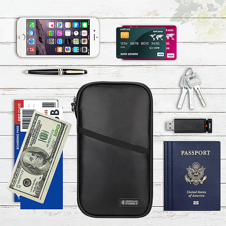 RFID blocking, fireproof and water-resistant passport holder with passport, credit card, and other essentials