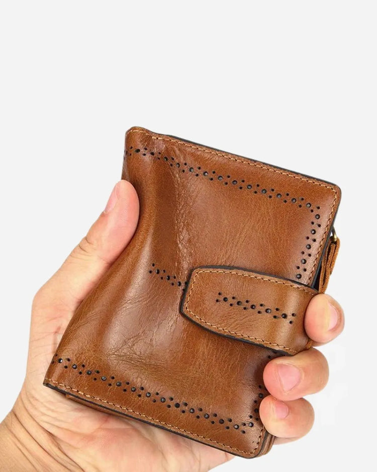 Individual showcasing RFID blocking brown leather wallet