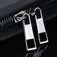 FireproofClose-up view of black zipper pulls on the Fireproof Expanding File Folder Document Organizer