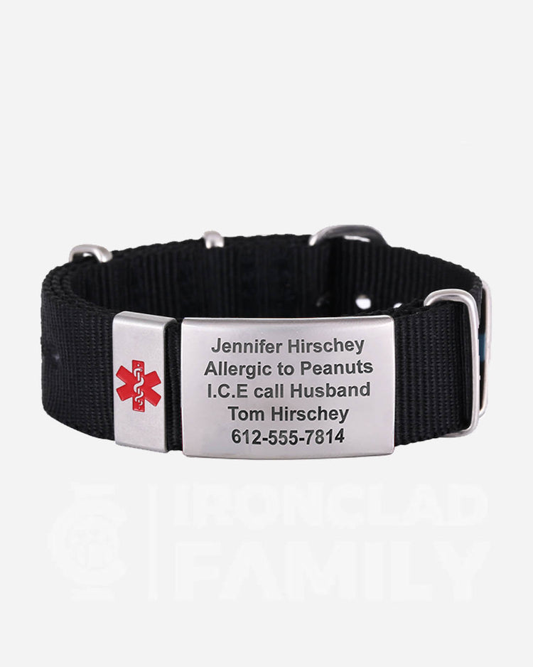 Emergency medical ID tag attached to a black fabric strap of the bracelet