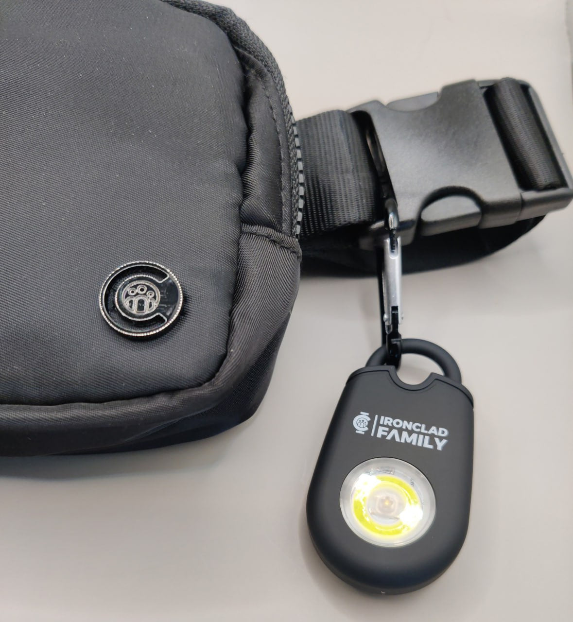 Personal alarm fanny pack with an attached light