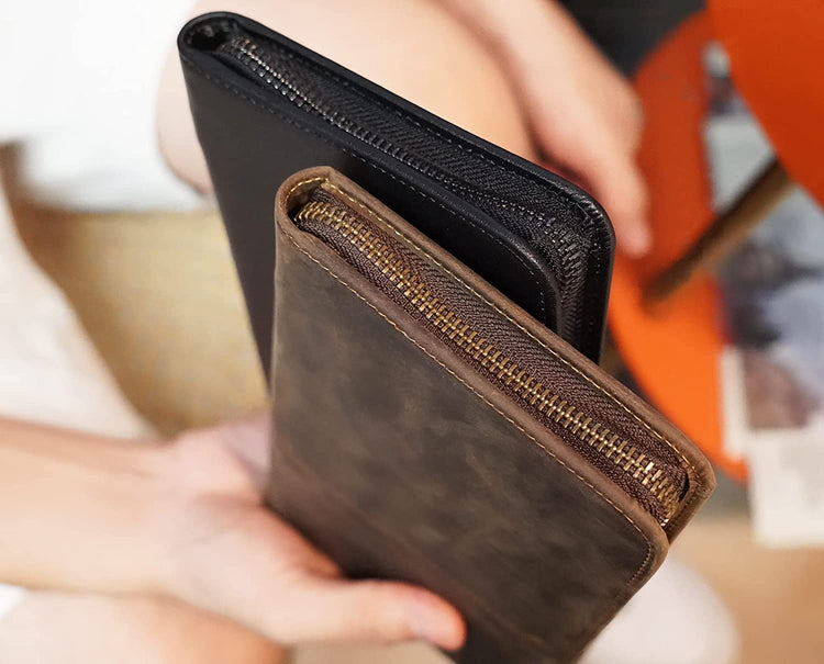 A man showcasing the RFID blocking cowhide leather multi-passport holder with dual zippers