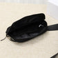 Black waterproof fanny pack with a visible zipper